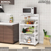 A white Aurora oven rack with multiple shelves, placed in a kitchen setting with a microwave on top and various kitchen items around it.