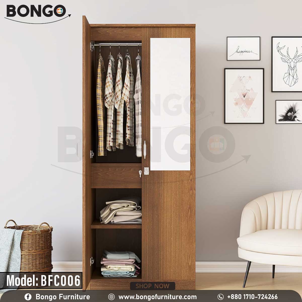 A wooden legacy cupboard with open doors showing clothes hanging inside, placed in a room with a chair and decorative wall art.