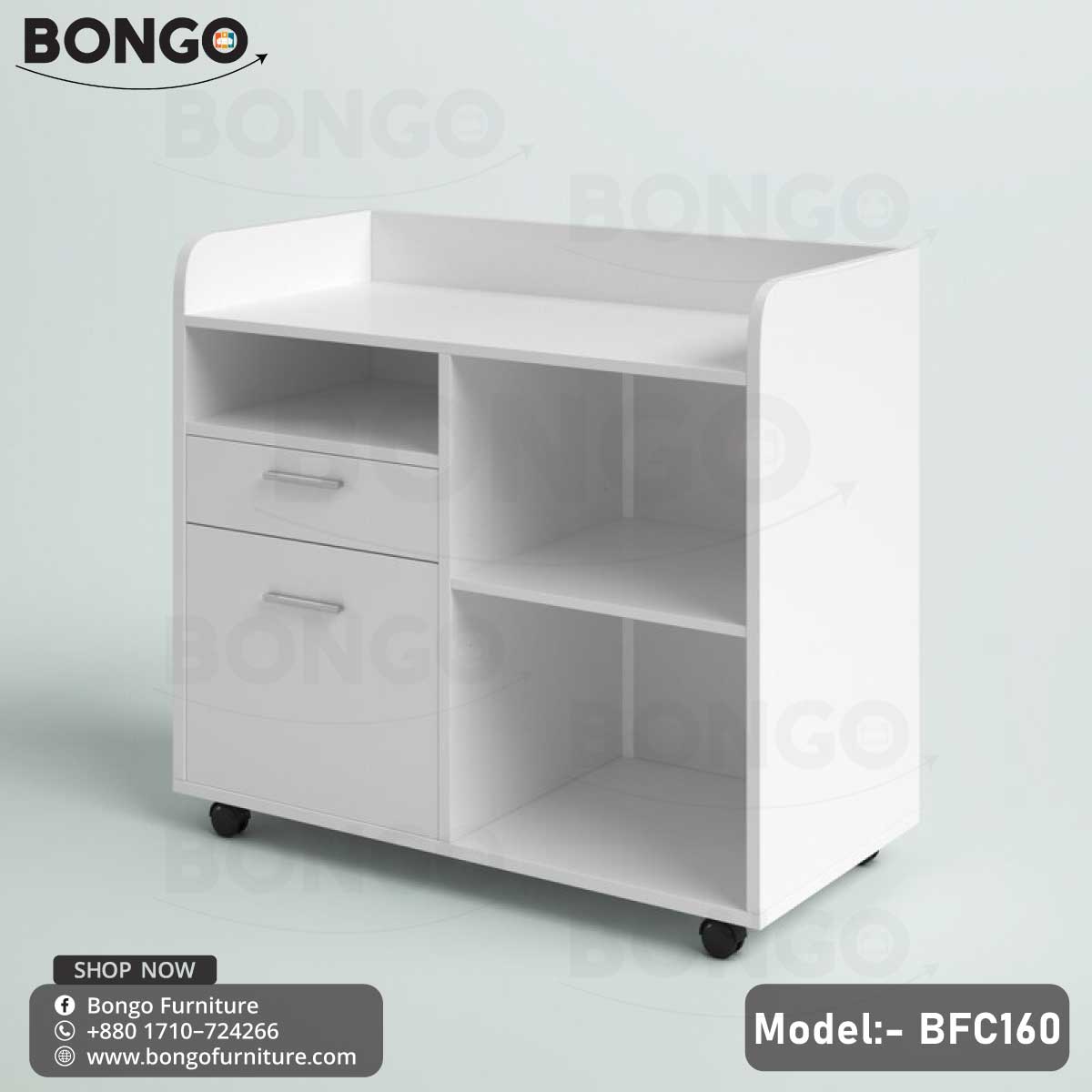 A white Enigma Drawer Unit with model number BFC160, featuring a single drawer and a lower shelf, set against a background of a living room with a potted plant and decorative items.
