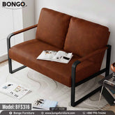 A modern, industrial-style loveseat with a black tubular metal frame. The loveseat has a single seat cushion and two back cushions, all upholstered in a smooth brown leather. The tops of the metal armrests are accented with a strip of wood. The loveseat is shown in a room setting on a patterned rug.