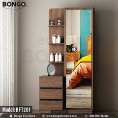 A wooden luxe dressing table with a mirror, model BFT201, with an upper drawer and lower shelves, displayed in a staged bedroom setting. A wooden luxe dressing table with a mirror, model BFT201, with an upper drawer and lower shelves, displayed in a staged bedroom setting.