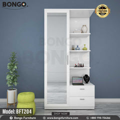 A white glamour dressing table with multiple shelves and a drawer, featuring a mirror and decorative items on it, placed against a blue wall with a potted plant and a colorful chair in the foreground. A white glamour dressing table with multiple shelves and a drawer, featuring a mirror and decorative items on it, placed against a blue wall with a potted plant and a colorful chair in the foreground.