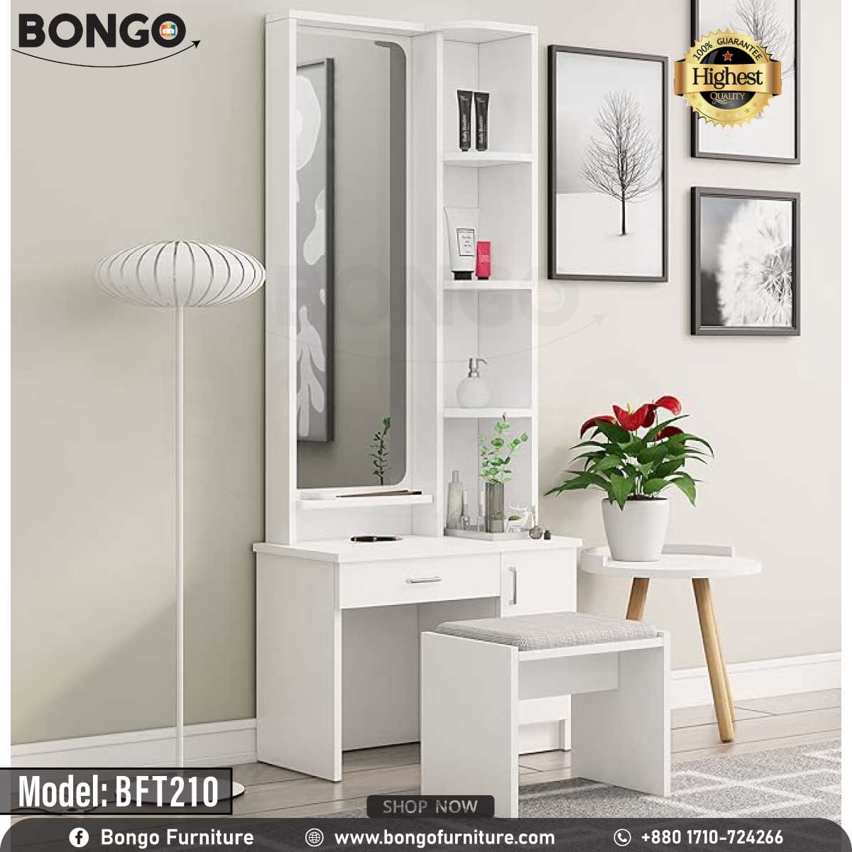 A white polished dressing table with a mirror, model BFT210, displayed in a room setting with decorative items and a plant beside it.