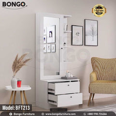 A promotional image of a modern white dressing table from BONGO. The unit features a large mirror next to a narrow tower of shelves. The base contains two large drawers and open storage cubbies. The dressing table is shown styled with photos and cosmetics in a bedroom setting. A "Highest Quality" seal is displayed in the corner. A promotional image of a modern white dressing table from BONGO. The unit features a large mirror next to a narrow tower of shelves. The base contains two large drawers and open storage cubbies. The dressing table is shown styled with photos and cosmetics in a bedroom setting. A "Highest Quality" seal is displayed in the corner.