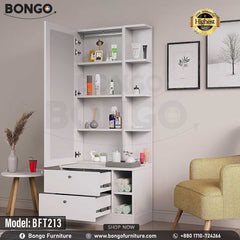 A promotional image of a modern white dressing table from BONGO. The unit features a large mirror next to a narrow tower of shelves. The base contains two large drawers and open storage cubbies. The dressing table is shown styled with photos and cosmetics in a bedroom setting. A "Highest Quality" seal is displayed in the corner. A promotional image of a modern white dressing table from BONGO. The unit features a large mirror next to a narrow tower of shelves. The base contains two large drawers and open storage cubbies. The dressing table is shown styled with photos and cosmetics in a bedroom setting. A "Highest Quality" seal is displayed in the corner.
