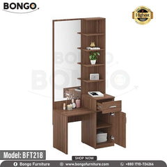 A brown Shine Dressing Table with a mirror, drawers, and a bench, placed in a bright room setting. The model number BFT218 is visible on the table. A brown Shine Dressing Table with a mirror, drawers, and a bench, placed in a bright room setting. The model number BFT218 is visible on the table.