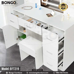 A promotional image of a modern white vanity set from BONGO, shown in a bedroom. The dressing table features a large central mirror with an integrated LED light, flanked by small shelves. The base includes multiple handleless drawers and a cabinet, with a matching white stool tucked underneath. A "Highest Quality" seal is in the top corner. A promotional image of a modern white vanity set from BONGO, shown in a bedroom. The dressing table features a large central mirror with an integrated LED light, flanked by small shelves. The base includes multiple handleless drawers and a cabinet, with a matching white stool tucked underneath. A "Highest Quality" seal is in the top corner.