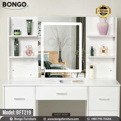 A promotional image of a modern white vanity set from BONGO, shown in a bedroom. The dressing table features a large central mirror with an integrated LED light, flanked by small shelves. The base includes multiple handleless drawers and a cabinet, with a matching white stool tucked underneath. A "Highest Quality" seal is in the top corner. A promotional image of a modern white vanity set from BONGO, shown in a bedroom. The dressing table features a large central mirror with an integrated LED light, flanked by small shelves. The base includes multiple handleless drawers and a cabinet, with a matching white stool tucked underneath. A "Highest Quality" seal is in the top corner.