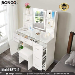 A promotional image of a modern white vanity set from BONGO, shown in a bedroom. The dressing table features a large central mirror with an integrated LED light, flanked by small shelves. The base includes multiple handleless drawers and a cabinet, with a matching white stool tucked underneath. A "Highest Quality" seal is in the top corner. A promotional image of a modern white vanity set from BONGO, shown in a bedroom. The dressing table features a large central mirror with an integrated LED light, flanked by small shelves. The base includes multiple handleless drawers and a cabinet, with a matching white stool tucked underneath. A "Highest Quality" seal is in the top corner.