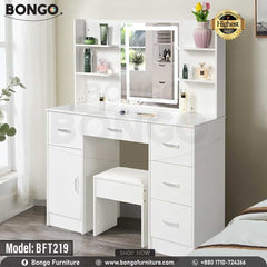 A promotional image of a modern white vanity set from BONGO, shown in a bedroom. The dressing table features a large central mirror with an integrated LED light, flanked by small shelves. The base includes multiple handleless drawers and a cabinet, with a matching white stool tucked underneath. A "Highest Quality" seal is in the top corner. A promotional image of a modern white vanity set from BONGO, shown in a bedroom. The dressing table features a large central mirror with an integrated LED light, flanked by small shelves. The base includes multiple handleless drawers and a cabinet, with a matching white stool tucked underneath. A "Highest Quality" seal is in the top corner.