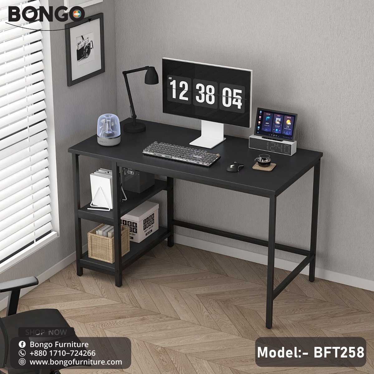 A trendy computer desk with a black steel frame and a laminated board tabletop, featuring a computer monitor, a lamp, a clock, and decorative items.