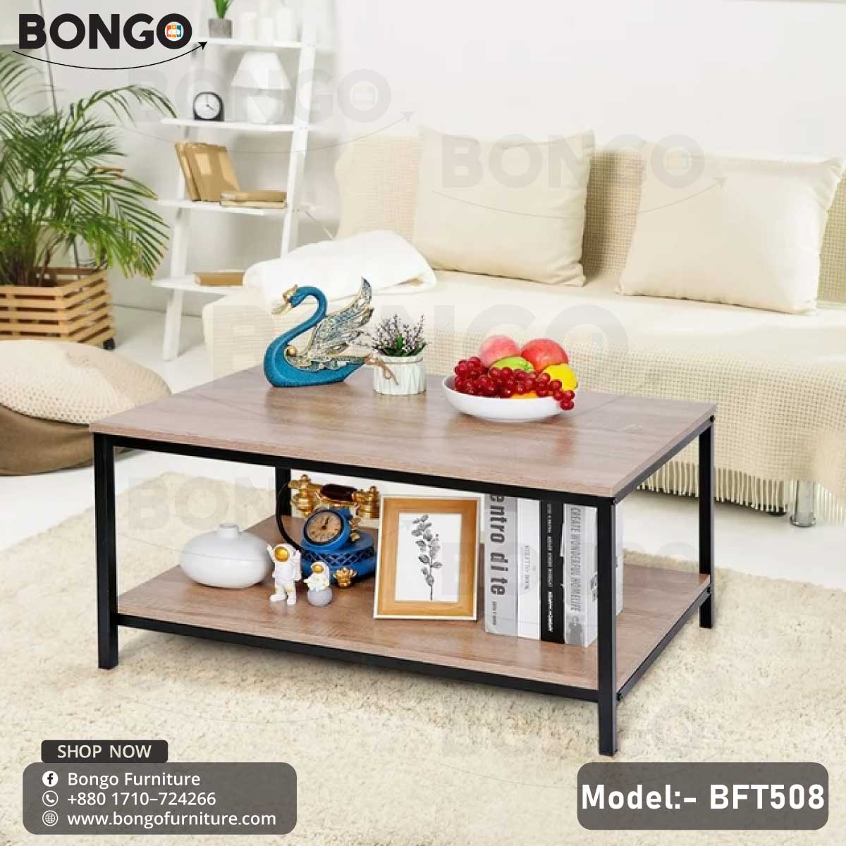 A black steel frame pours tea table with a wooden tabletop, model BFT508, placed in a living room setting with a laptop, books, and a plant on top.