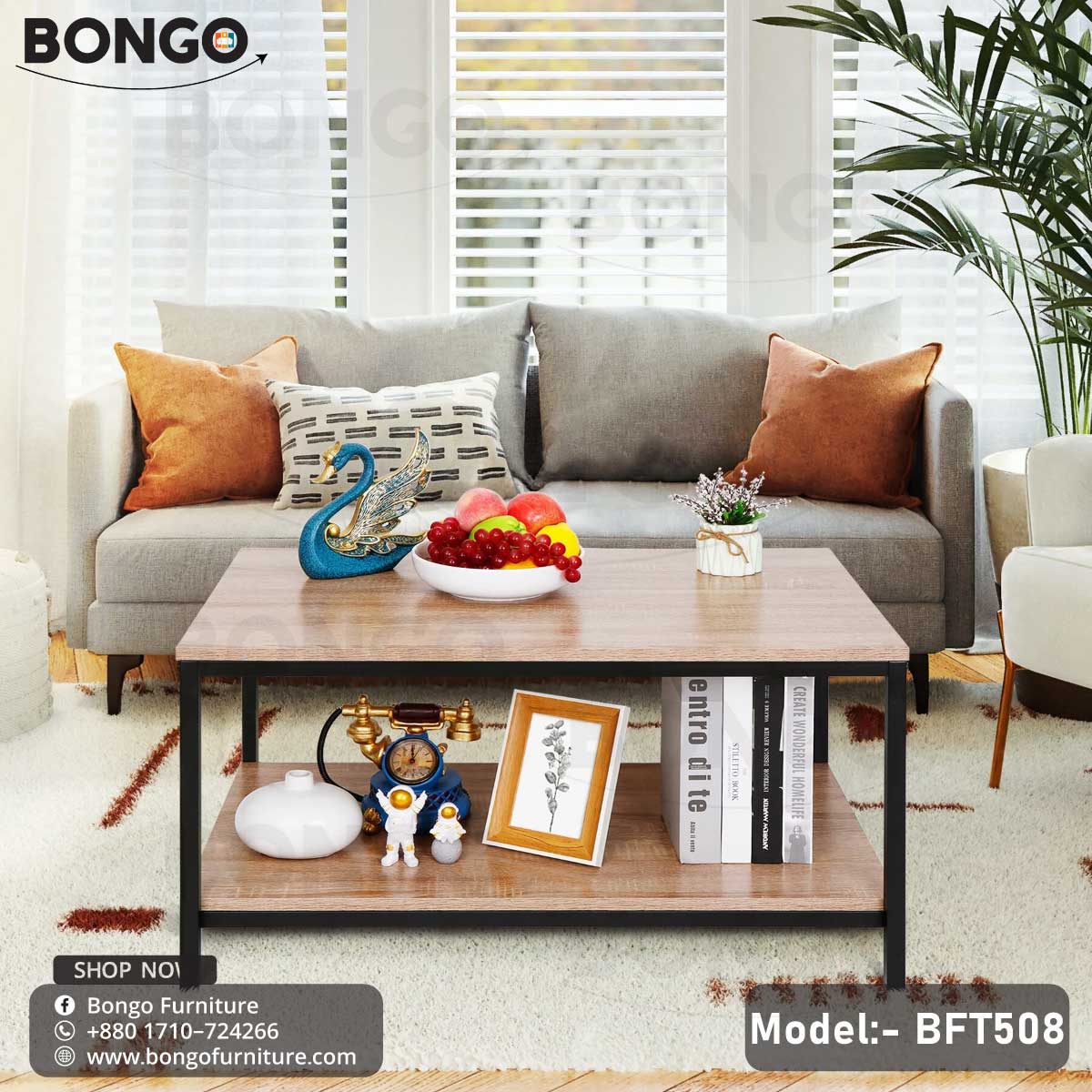 A black steel frame pours tea table with a wooden tabletop, model BFT508, placed in a living room setting with a laptop, books, and a plant on top.