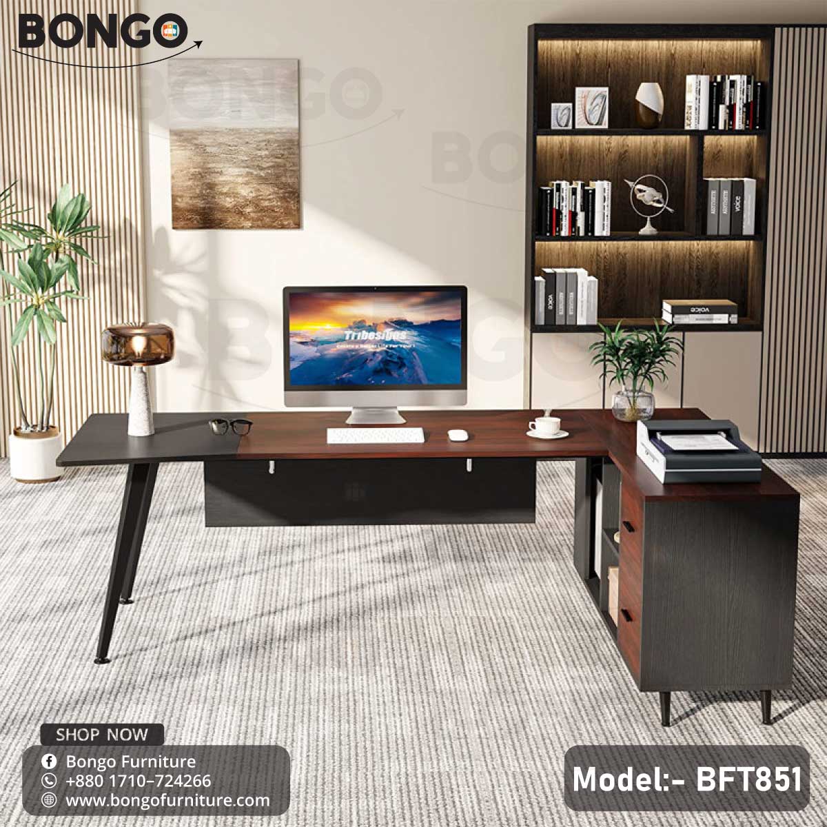 A Dynasty Boss Table model BFT851 with a black steel frame and a brown laminated tabletop, featuring a desk setup with office chairs and decorative plants in the background.