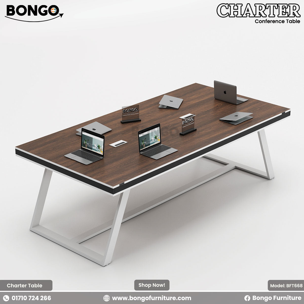 A rectangular black conference table with a steel base, surrounded by black office chairs with wheels. The table has a white rectangular name plate on each side.