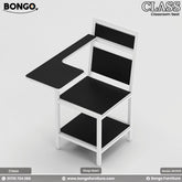 A black and white student chair with a metal frame and laminated board seat, designed for classroom use.