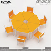 An image of a yellow hexagonal modular school table with white steel legs and orange chairs, branded by Bongo.