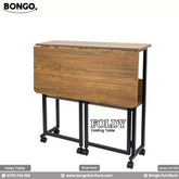 A foldable rectangular table with a Water Resistant Strong Laminated Board tabletop and black metal legs, on wheels, with the brand name 'BONGO' visible.