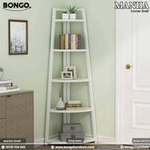 White corner shelf with books, plants, and decor against a light green wall.