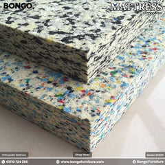 A promotional image for a BONGO orthopedic mattress, showcasing two thick blocks of rebounded foam. The close-up reveals the composite, flecked texture of the material. The top block of foam is primarily white, gray, and black, while the bottom block is more colorful with flecks of blue, red, and yellow. A promotional image for a BONGO orthopedic mattress, showcasing two thick blocks of rebounded foam. The close-up reveals the composite, flecked texture of the material. The top block of foam is primarily white, gray, and black, while the bottom block is more colorful with flecks of blue, red, and yellow.