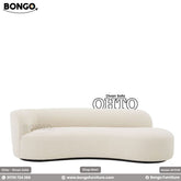 A white divan sofa with a minimalistic design, featuring a low back and a sleek, modern aesthetic.