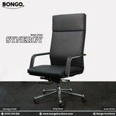 A promotional product image of the "SYNERGY Boss Chair," displaying two identical chairs from different angles against a studio background. The chair is a modern, high-back executive office chair upholstered in black leather-like material. It features sleek armrests with metallic accents and a five-star polished chrome base with caster wheels. The chair on the left provides a direct front view, while the chair on the right is shown at a three-quarter angle. The "BONGO" and "SYNERGY" brand names are in the t