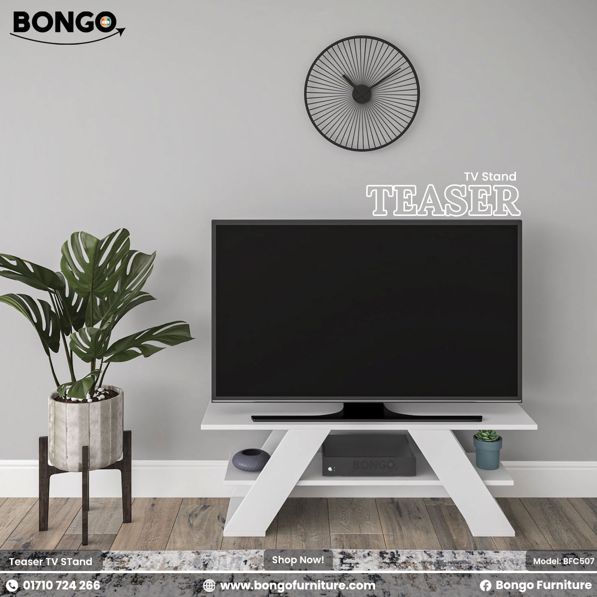 A promotional image of the "TEASER TV Stand" by Bongo, showcased in a modern living room setting. The TV stand is solid white and features a distinctive design with two wide, angled, A-frame style legs and a lower shelf. A large flat-screen television sits on top of the stand. To the left is a large potted plant in a grey pot on a dark wood stand, and on the light grey wall above is a black, minimalist, sunburst-style clock.
