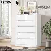 A promotional image of the "VICTORIAN Chest of Drawers." The tall, modern dresser is solid white and features six handleless drawers. The top row has two smaller drawers side-by-side, followed by four full-width drawers below. The top of the chest is decorated with a vase of white flowers, a small clock, and other decorative figurines. The "BONGO" brand logo is in the top-left corner.