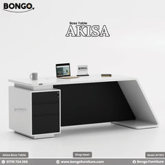 A promotional image of a modern executive desk, branded "AKISA Boss Table". The desk has a black top and a sleek, contemporary design. One side is supported by a solid, curved black leg, while the other rests on a black pedestal with three white drawers. On the desktop, there is an open laptop, a mug, and a small notebook. The "BONGO" logo is displayed in the top-left corner and on a small sign on the desk.