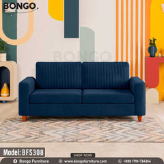A Deep Blue upholstered sofa with wooden legs, positioned in a room with colorful wall art and decor.