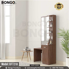 A brown Shine Dressing Table with a mirror, drawers, and a bench, placed in a bright room setting. The model number BFT218 is visible on the table.