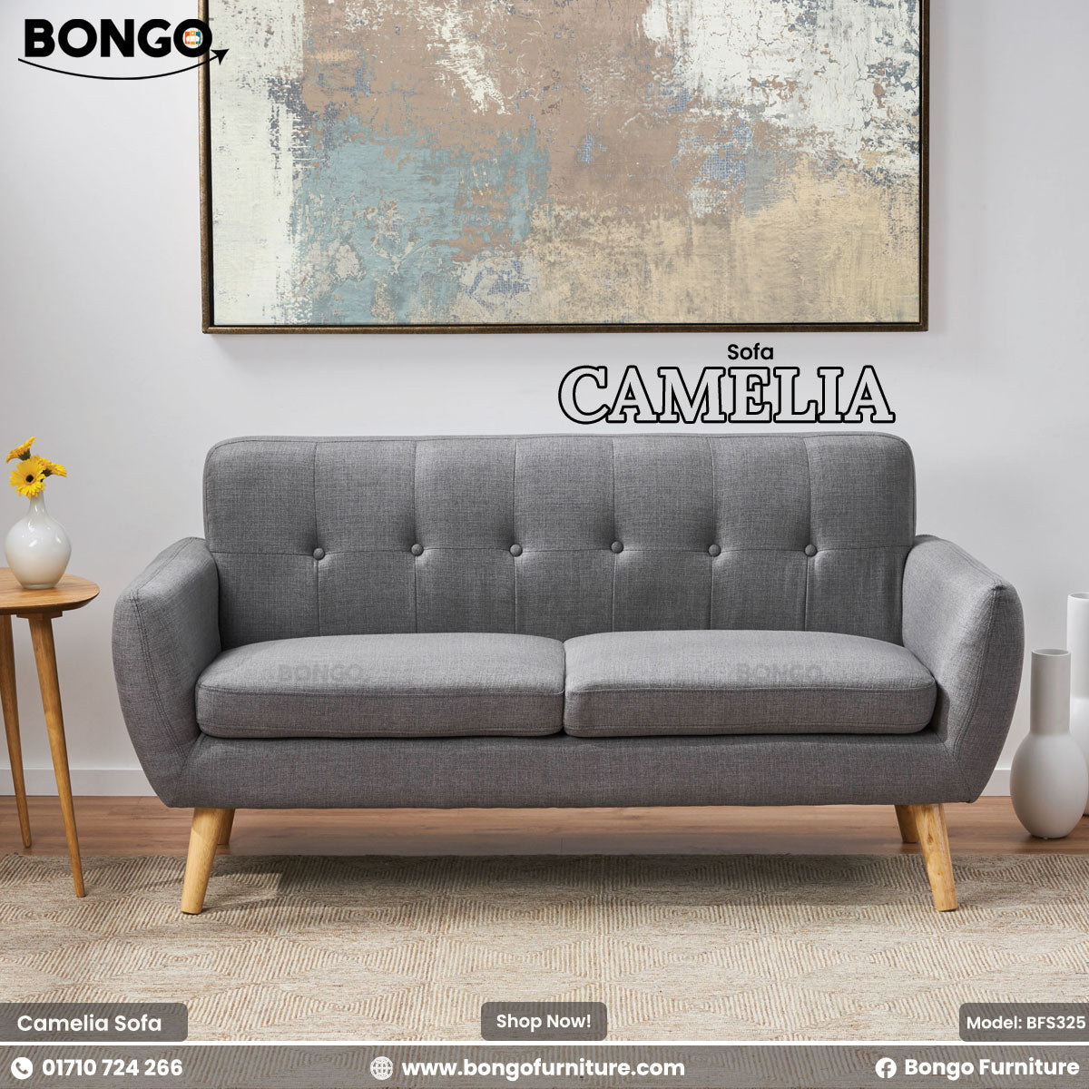 Gray sofa named 'Camelia' by Bongo Furniture in a room setting with decor elements.