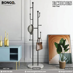 A promotional image shows a modern black metal hall tree with a round white base, standing in an entryway. A blue robe, a light-colored hat, and a tan backpack hang from its various hooks. The hall tree is set against a white brick wall, next to a large window on the left and a small potted plant on the right. The flooring is light-colored wood. In the top corners of the image are the brand logos "BONGO" and "ECHOES Hall Tree".