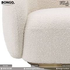A beige Fila sofa with a modern design, featuring plush foam and a round footstool, displayed against a white background.