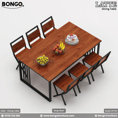 A promotional image of the 'LATTE Dining Table' set from BONGO. The six-seater industrial-style set includes a rectangular table and six chairs, all combining a reddish-brown wood-grain finish with black metal frames. The table is shown from a high angle, staged with a cake and bowls of fruit.