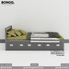 A promotional image for the 'MISAO Double Bed', a modern platform bed with built-in storage. The bed has a dark gray frame and a low headboard. Its base consists of a single row of five storage drawers with white recessed handles. The bed is styled with green striped bedding and a throw blanket.