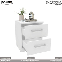 A modern white two-drawer nightstand shown in a bedroom setting. The simple, rectangular bedside table has two drawers with silver bar pulls and is decorated on top with a plant, books, and a classic silver alarm clock.