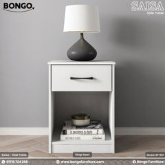 A white side table with a drawer and an open shelf, featuring a black handle, with the BONGO brand logo on the top right corner.