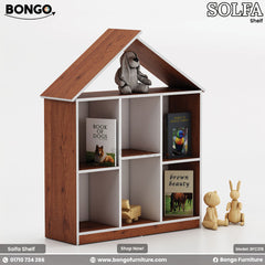 A children's bookshelf shaped like a house, featuring a light Water Resistant Strong Laminated Board frame and a black interior. The bookcase has six square cubbies for storage and is topped with a simple gabled roof outline. It is shown styled with children's books, a stuffed dog on top, and wooden toys.
