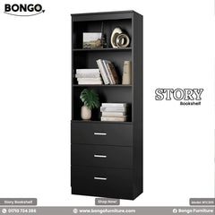 A promotional image of the "STORY Bookshelf" by Bongo, a tall and narrow modern storage unit finished in solid black. The bottom half of the unit consists of three drawers with sleek, horizontal silver handles. The top half features four open shelves, which are styled with books, a miniature Eiffel Tower, vases, and other decorative objects. The bookshelf is set against a plain, light grey background.