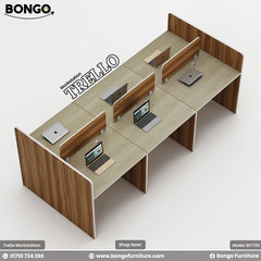 A professional workstation named 'Trello' by Bongo Furniture, featuring multiple desks arranged in a row with office equipment like laptops and phones on top, enclosed by black partitional walls.