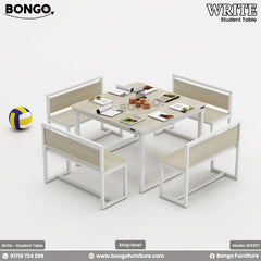 A set of student furniture including a rectangular table with a yellow tabletop and black steel frame, surrounded by four orange benches with black steel frames. There is also a basketball and a soccer ball next to the furniture.