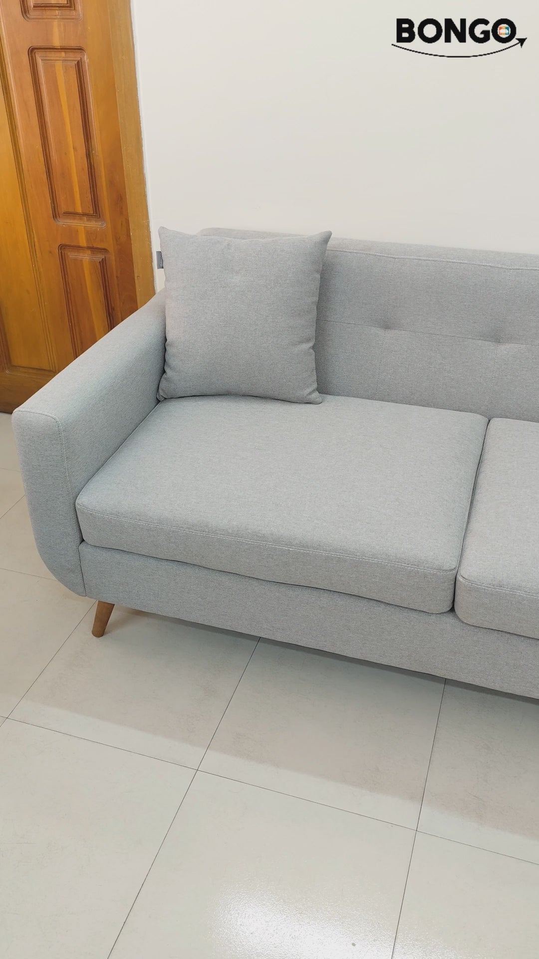 Bongo Furniture Elena Sofa model BFS323, a minimalist beige fabric 2-seater couch with tufted back detail and dark wooden legs