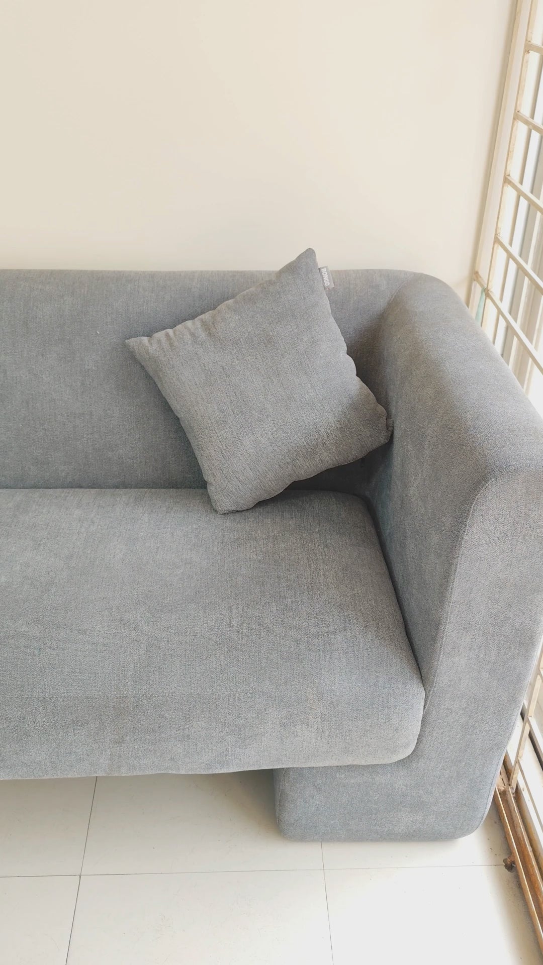 Bongo Furniture Muffin Sofa model BFS333, a modern cream-colored 2-seater sofa with a unique rounded silhouette and seamless minimalist design